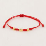 Pulsera De Oro 18k Macramé Con Cilindros Diamantados 6mm Hilo Rojo 0,42gr