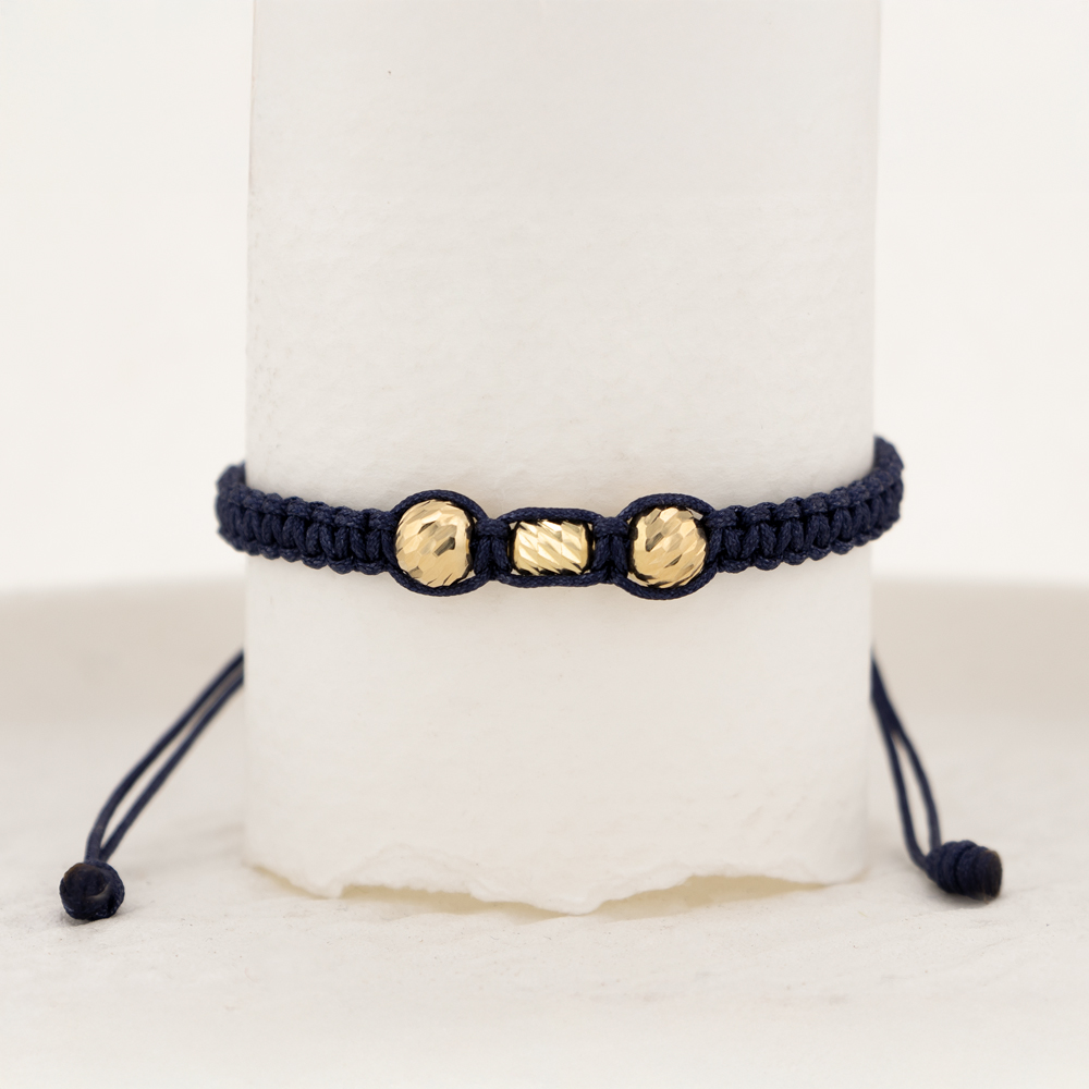 Pulsera De Oro 18k Macramé Con 1 Cilindro Diamantado 3x5mm 2 Esferas 5mm Diamantadas, Hilo Azul 0,43gr. Largo 19cm