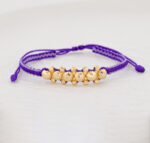 Pulsera De Oro 18k Macramé Con 6 Esfera 6mm Diamantada, Hilo Morado 0,6gr. Largo 19cm