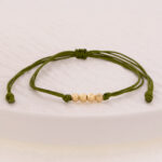 Pulsera Oro 18K Con 4 Esferas Diamantadas 4mm Tejida Con Hilo Verde - Image 2